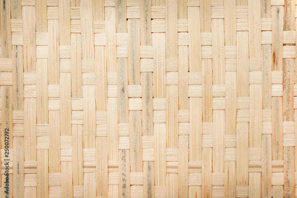Top view texture brown bamboo woven mat for crafts background , natural seamless patterns abstract Top view texture brown bamboo woven mat for crafts background , natural seamless patterns abstract