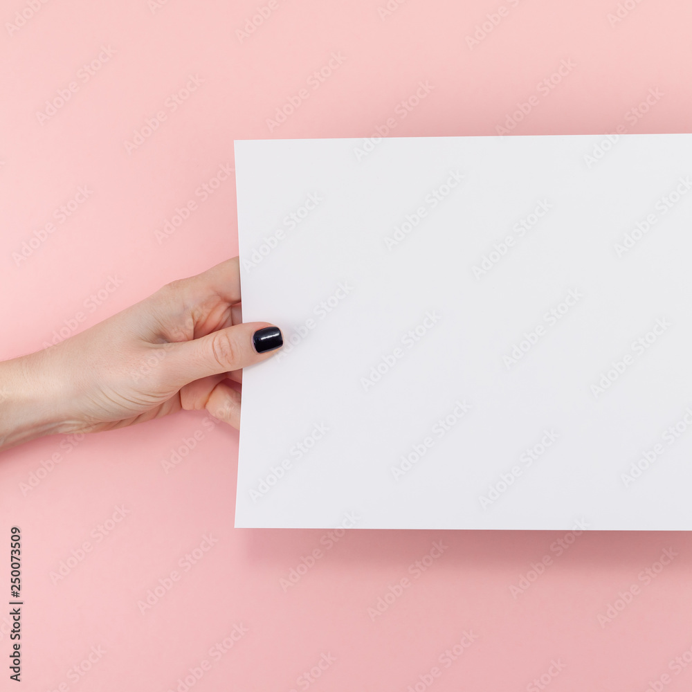 Woman hands with blank A4 paper sheet mockup Woman hands with blank A4 paper sheet mockup