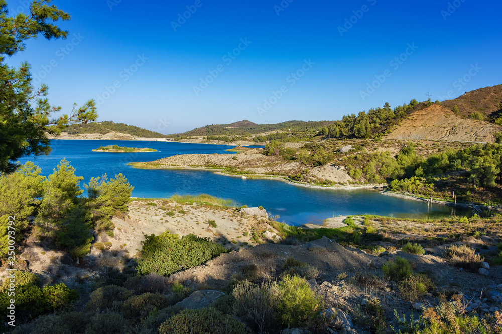 Wild nature around reservoir of Gadoura Dam on Rhodes Island (Rhodes, Greece)