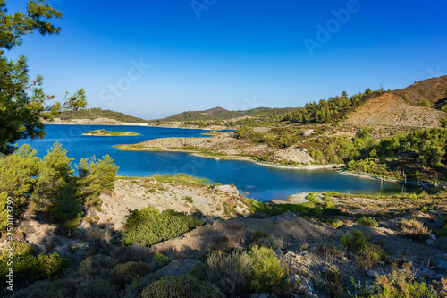 Wild nature around reservoir of Gadoura Dam on Rhodes Island (Rhodes, Greece)