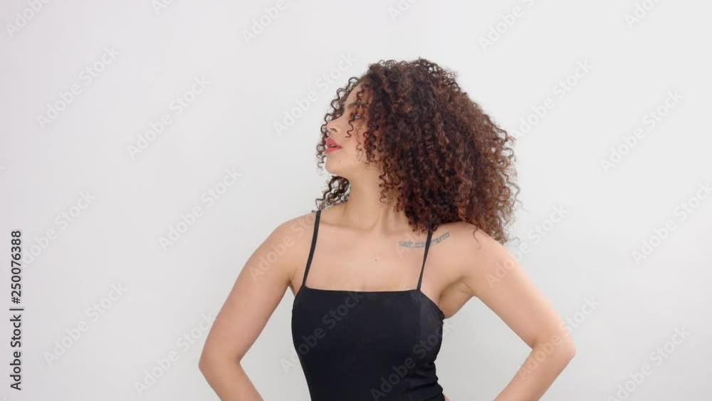 mixed race black woman with freckles and curly hair dancing slowly mixed race black woman with freckles and curly hair dancing slowly