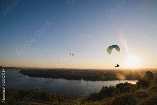 Paragliding in the sky over the river