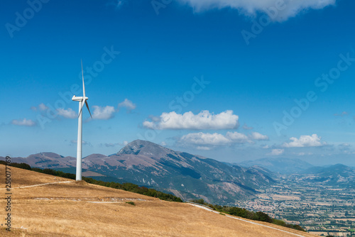 Wind turbine on a mountain ridge in Italy. photo