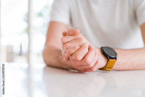 Close up young man hands together