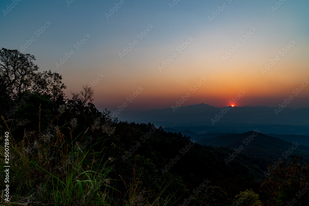 The view of sunset on the top of the mountain. The view of sunset on the top of the mountain.