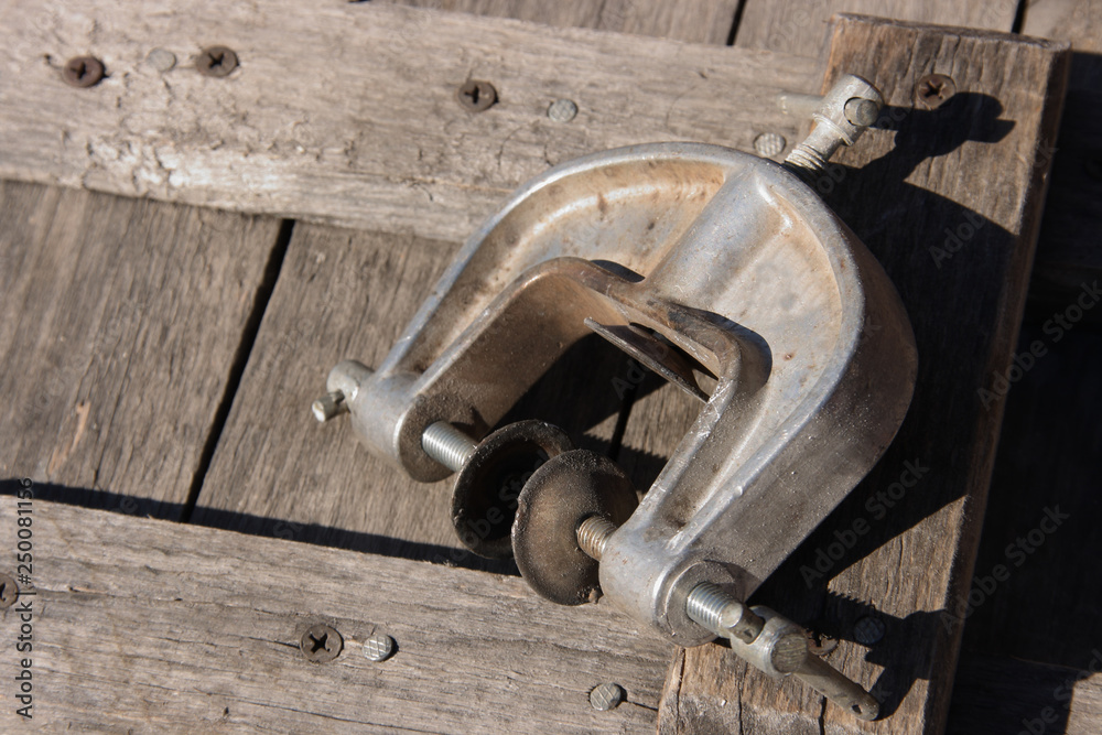 Clamp on a wooden cover Clamp on a wooden cover