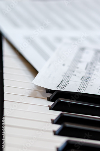 Music book on the piano keys. Selective focus.
