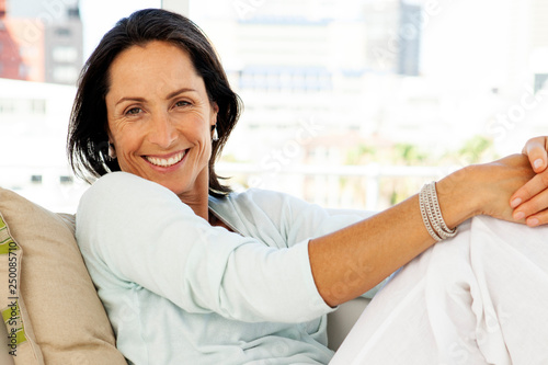 Woman relaxing at home - beautiful middle aged brunette - portrait