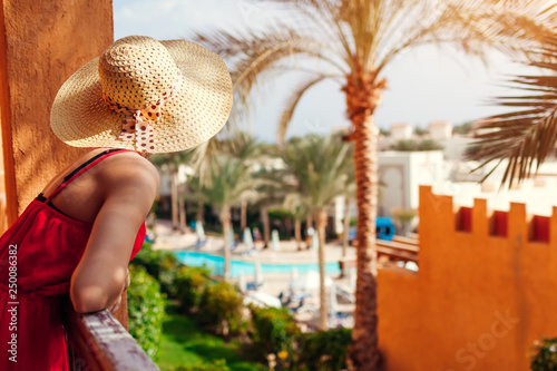 Fényképezés Young woman enjoying the view from hotel balcony in Egypt