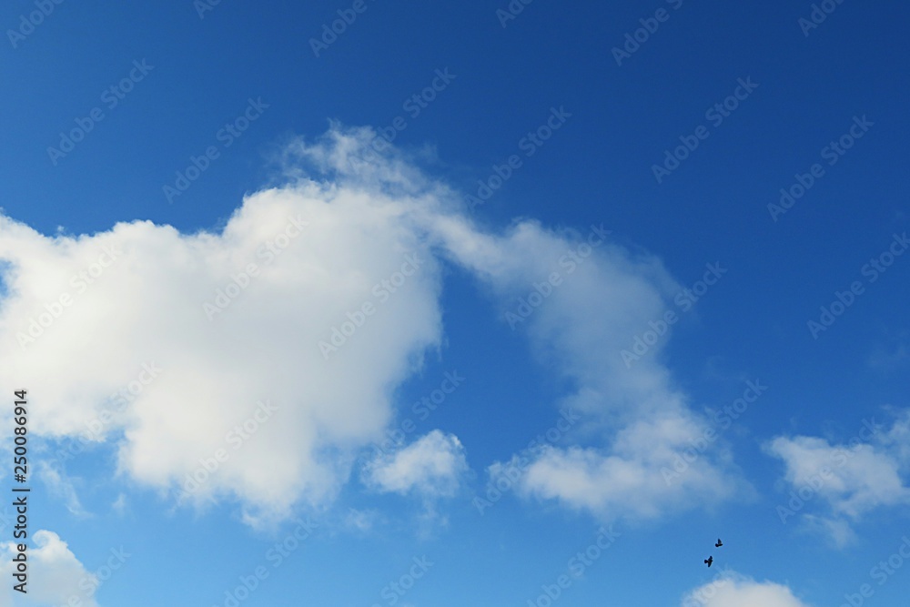 Beautiful heart shape cloud in blue sky background, natural cloudscape Beautiful heart shape cloud in blue sky background, natural cloudscape