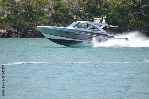 High-end cabin cruiser speeding on Government Cut ,Miami,Florida