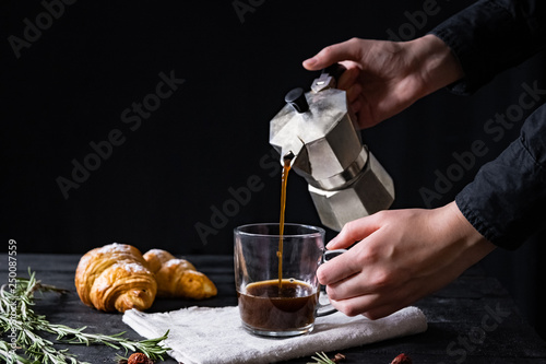 Konstfotografi Pouring coffee from an italian percolator, shot in low key