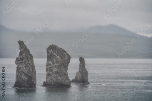 Picturesque seascape of Kamchatka: - Three Brothers Rocks in Avachinskaya Bay (Avacha Bay) in Pacific Ocean