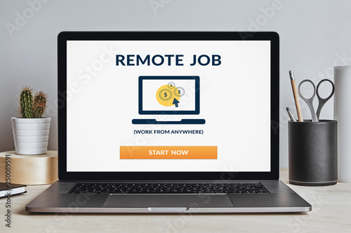Remote job concept on laptop screen on modern desk