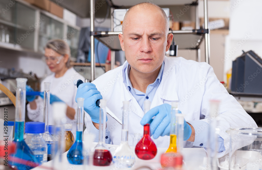 Fototapeta premium Chemist analyzing liquid samples