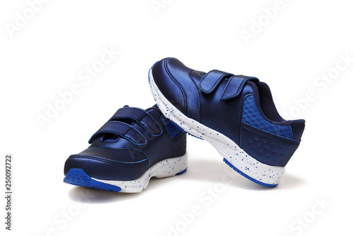 Pair of sports shoes, blue sneakers isolated on white background. Top view.