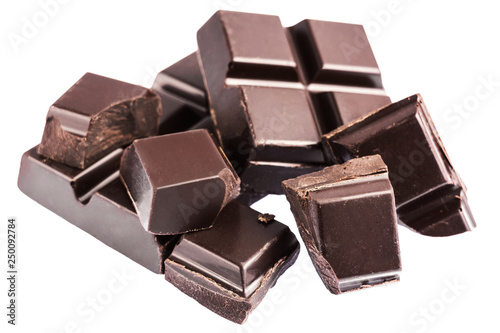 Chopped chocolate cubes, pieces of dark chocolate isolated on white background
