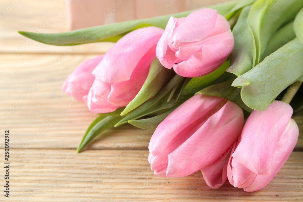 Beautiful bouquet of flowers of pink tulips on a natural wooden background. close-up. Spring. holidays. Beautiful bouquet of flowers of pink tulips on a natural wooden background. close-up. Spring. holidays.