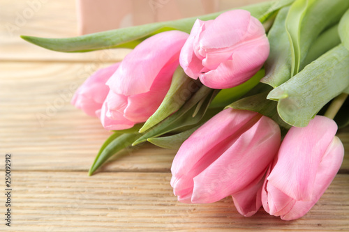 Beautiful bouquet of flowers of pink tulips on a natural wooden background. close-up. Spring. holidays.