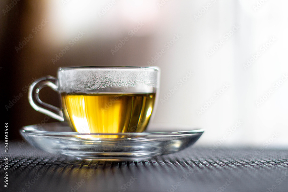Naklejka premium Transparent cup with tea. Cup of tea.