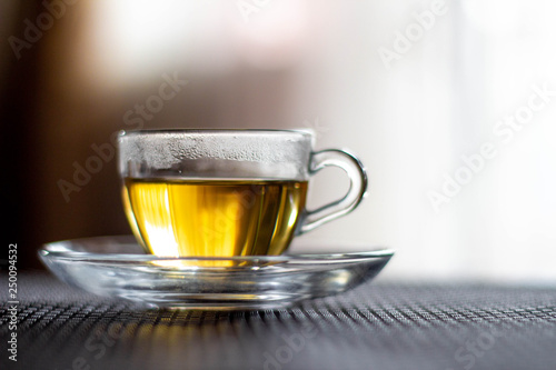 Transparent cup with tea. Close-up.