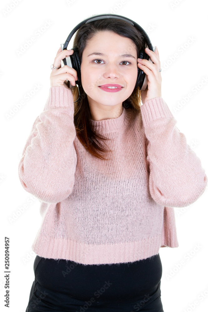 young woman with headphones looks in camera in white background young woman with headphones looks in camera in white background