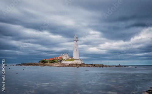  Dramatic sky above St. Mary's Lighthouse. Summer seascape. Whitley Bay, England. Great Britain. Long exposure photography