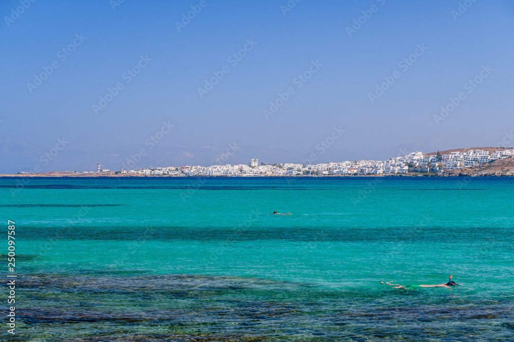 Picturesque view to Naussa from Kolymbithres beach. Paros island, Greece Picturesque view to Naussa from Kolymbithres beach. Paros island, Greece