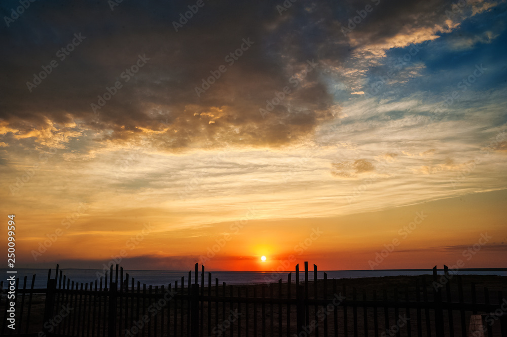 Beautiful natural textural background of the sunset on the lake, river. Salt lake Elton, Russia, sunset on the water Beautiful natural textural background of the sunset on the lake, river. Salt lake Elton, Russia, sunset on the water