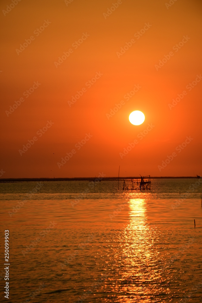 Sunset view by the sea on a bright day Sunset view by the sea on a bright day