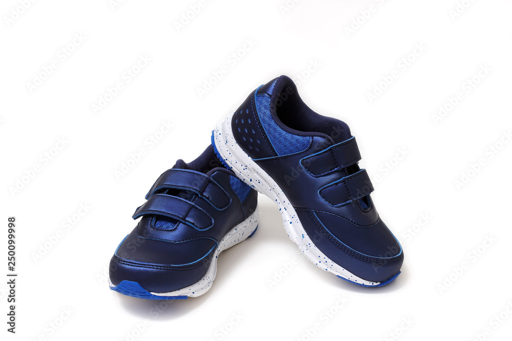 Pair of sports shoes, blue sneakers isolated on white background. Top view. Pair of sports shoes, blue sneakers isolated on white background. Top view.
