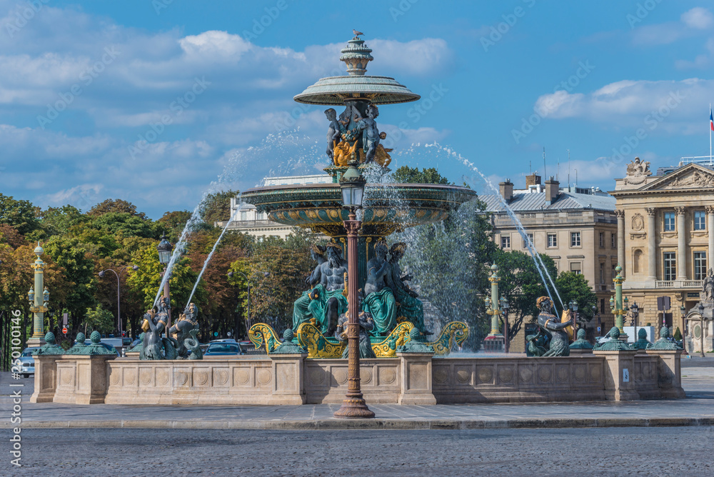 Obraz premium One of two Fountains on the Place de la Concorde in Paris on sunny summer day