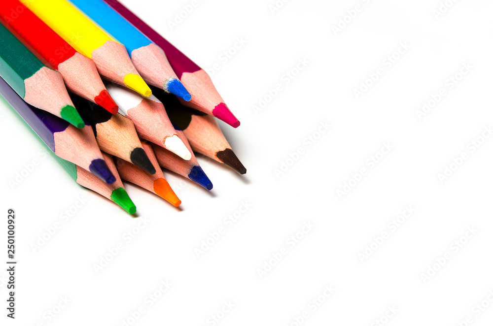 Colourful sharp pencils lie on a white background Colourful sharp pencils lie on a white background