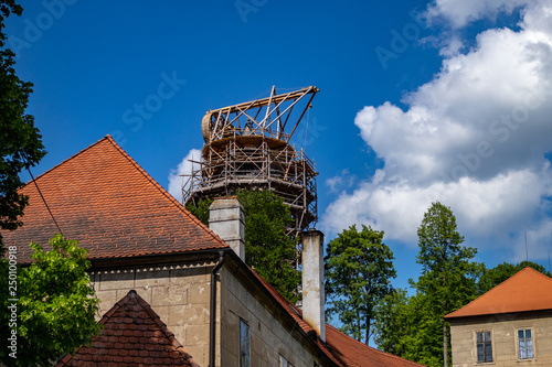 Rozmberk nad Vltavou,Cesky Republik-10May2018;View of the historic City Rozmberk nad Vltavou in the Czech Republic with historic buildings, churches and narrow streets in front of blue sky photo