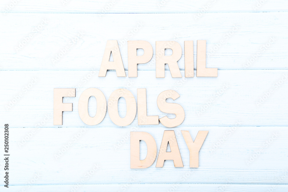 Inscription April Fool's Day on wooden table Inscription April Fool's Day on wooden table
