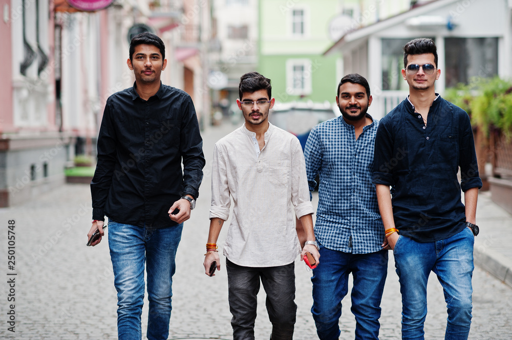 Obraz premium Group of four indian ethnicity friendship togetherness mans.
