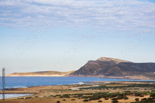 Landscape of mountain and the sea of Tunisia with clearly sky. Blue sea of Mediterranean in a midday time.