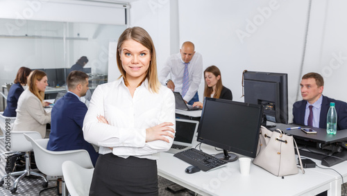 girl with working colleagues behind