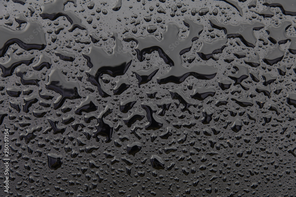 Drops of water on black texture. Walpaper Drops of water on black texture. Walpaper