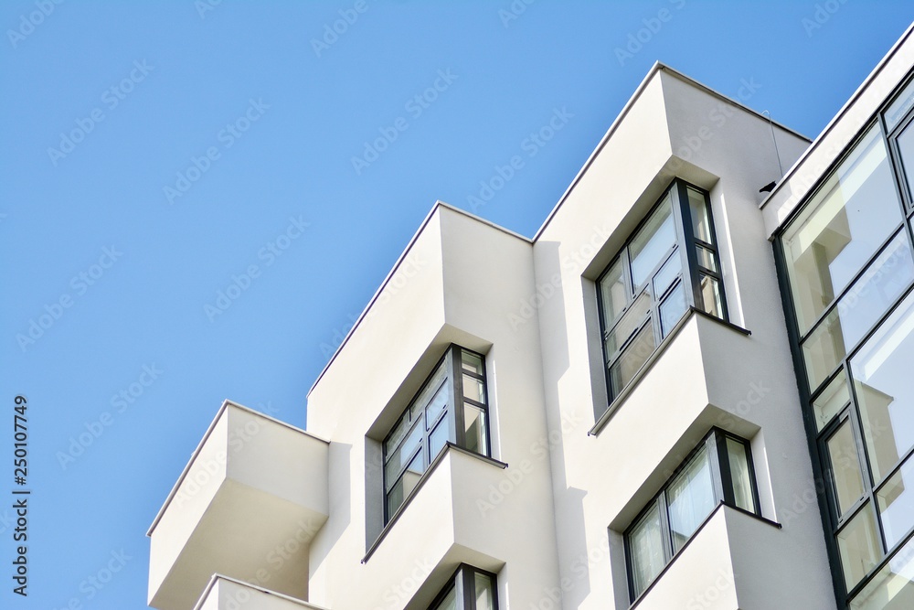 Modern white building with balcony on a blue sky Modern white building with balcony on a blue sky