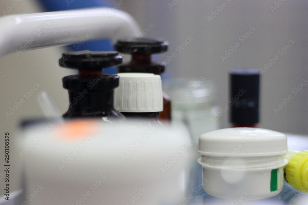 Jars of medicines with a blurred foreground - medical equipment in the dental office Jars of medicines with a blurred foreground - medical equipment in the dental office