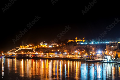 Belgrade, Serbia - February 10, 2019: Panorama of Belgrade with a view from Branko bridge at night with a reflection. View of kalemegdan fortress.