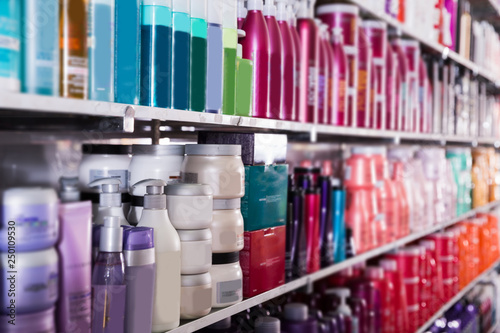 Picture of showcase with bottles of shampoos and conditioners