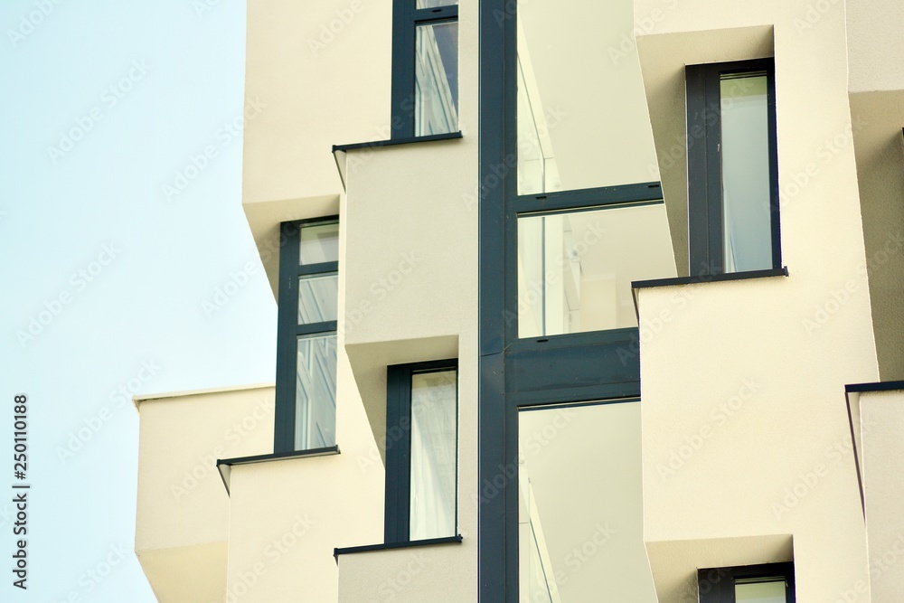 Modern white building with balcony on a blue sky Modern white building with balcony on a blue sky