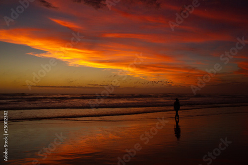 carefree woman dancing in the sunset on the beach. vacation vitality healthy living concept, Australia