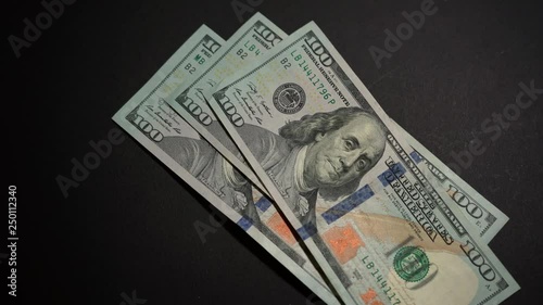 Woman re-counts three hundred dollar bills