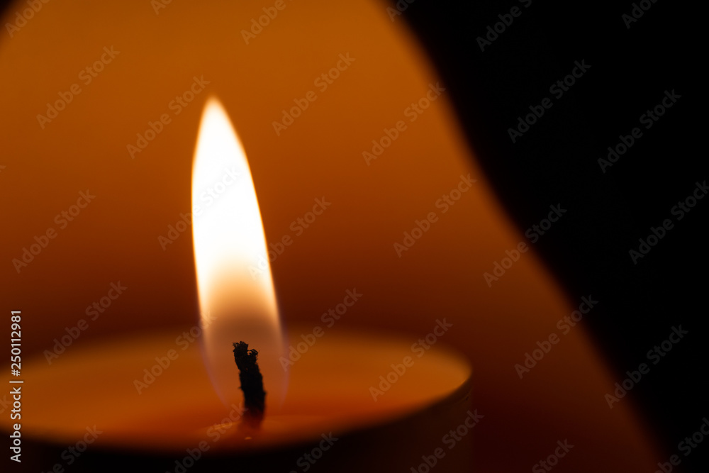 Underexposed low light photo of candle in aromatic lamp. Close-up view Underexposed low light photo of candle in aromatic lamp. Close-up view