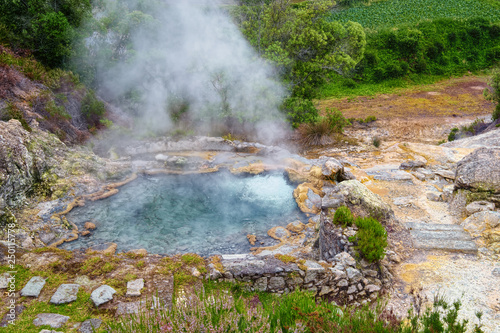 Natural geyser of boiling mineral water and evaporation, located near the Furnas town on Sao Miguel island of Azores, Portugal.