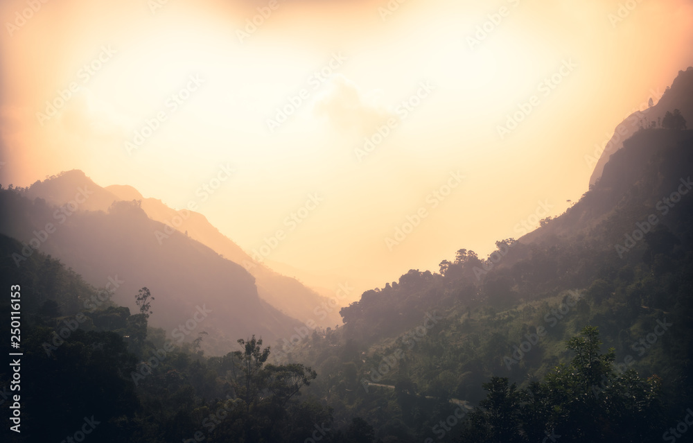 Sunrise mountains landscape with fog in the early morning in Sri Lanka nearby Ella mountain rock