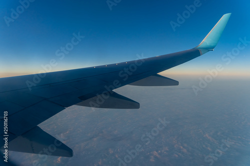 the plane in the sky, the view of the wing